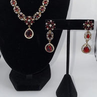 Elegant Ruby Red Jewelry Set with Matching Earrings & Tikka