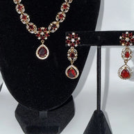 Elegant Ruby Red Jewelry Set with Matching Earrings & Tikka