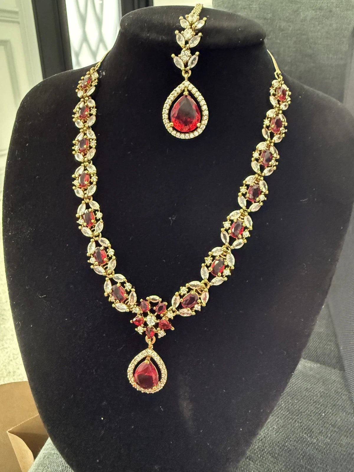 Elegant Ruby Red Jewelry Set with Matching Earrings & Tikka