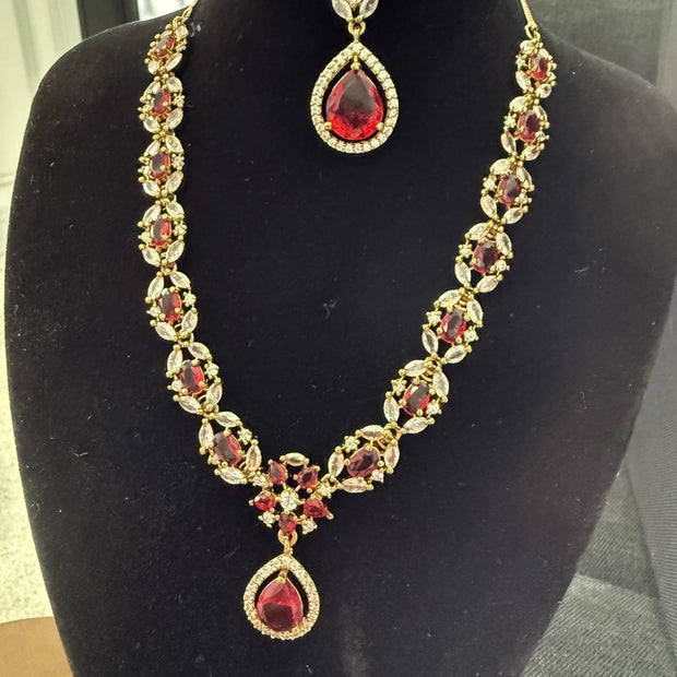 Elegant Ruby Red Jewelry Set with Matching Earrings & Tikka